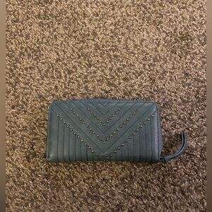 Blue wallet with gold stud design.